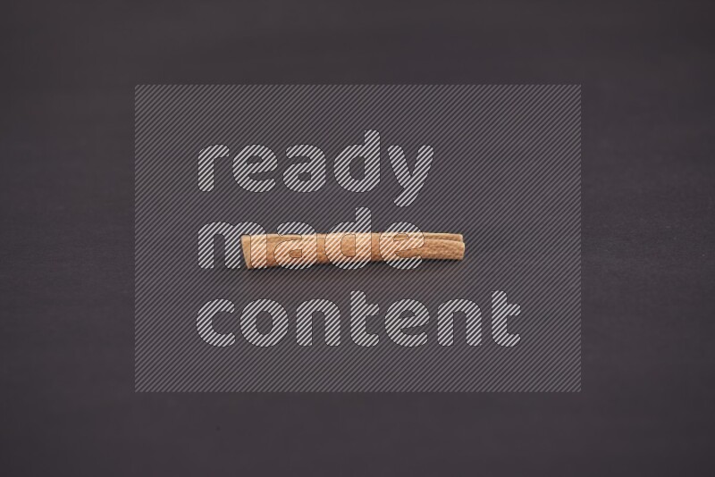 Cinnamon stick on black background