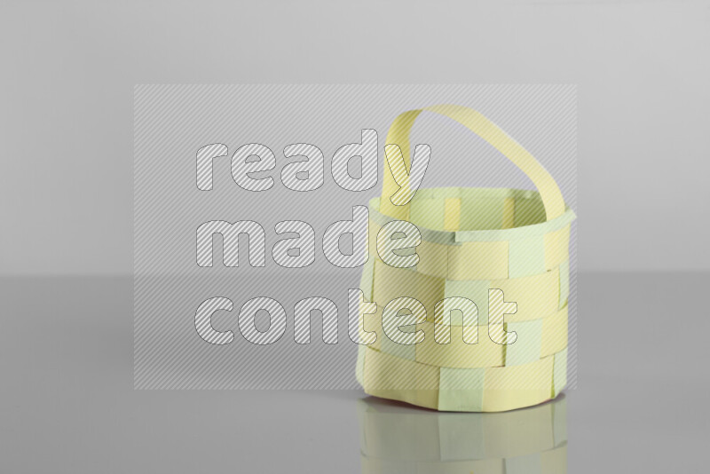 Origami easter basket on grey background
