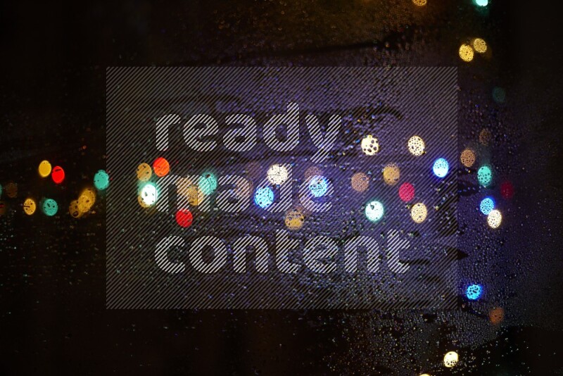 Bokeh light in multicolor with water drops