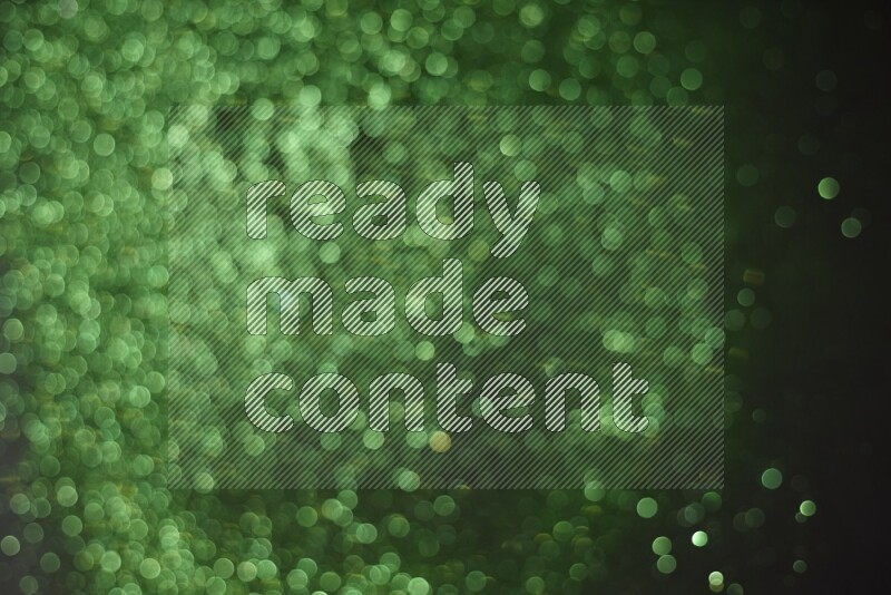 Green glitter powder isolated on black background