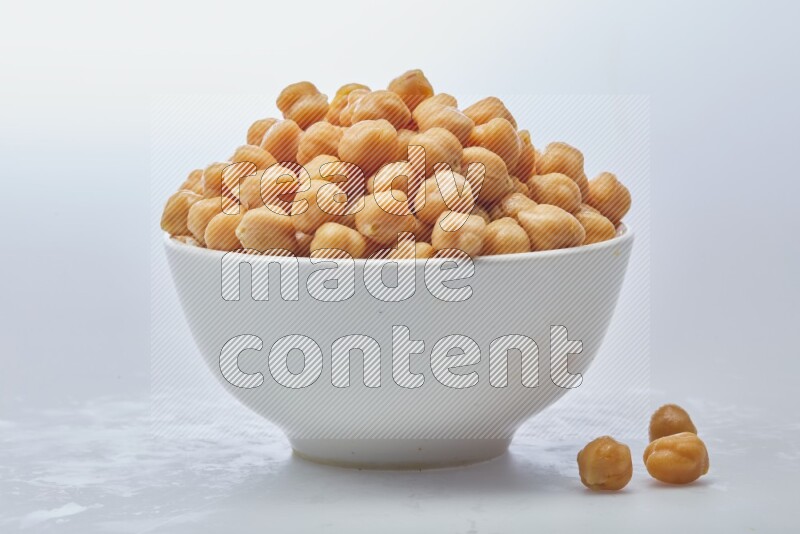 Close up shot of boiled chickpeas in a container on white background