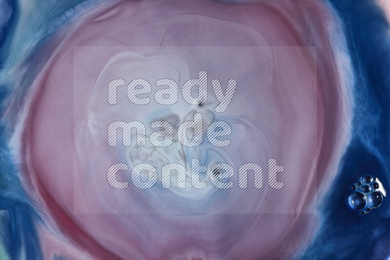 A close-up of abstract swirling patterns in blue, red and white