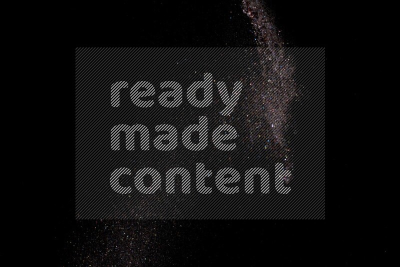 Multicolored glitter powder isolated on black background