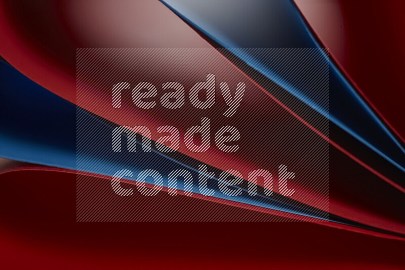 An abstract art showing red and blue paper sheets arranged in an overlapping curves