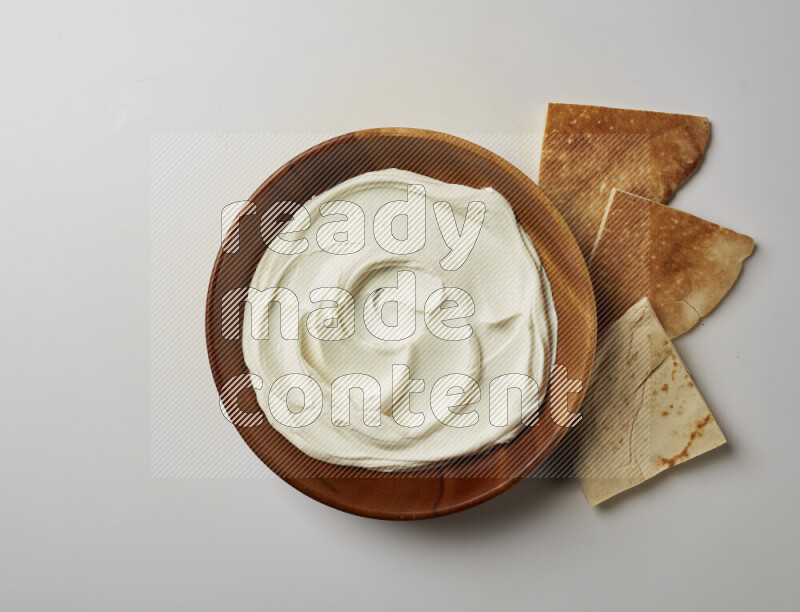 Plain Lebnah in a wooden plate on a white background