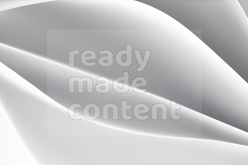 This image showcases an abstract paper art composition with paper curves in white created by light