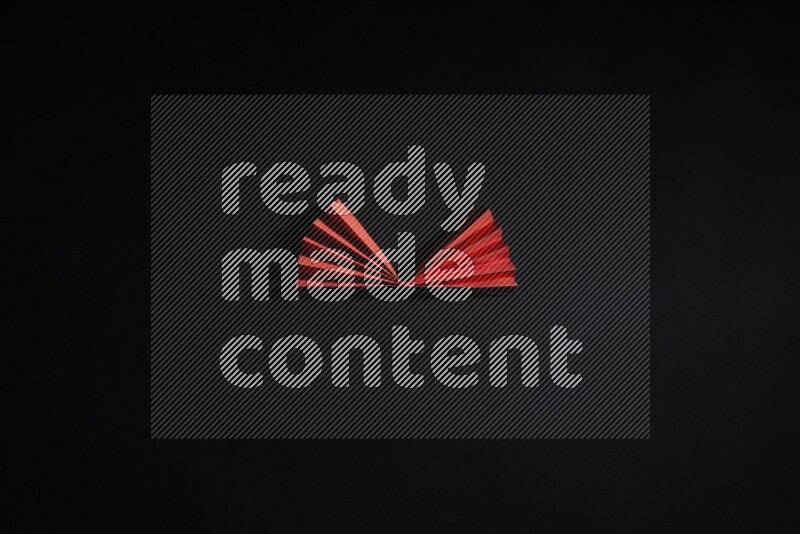 Red paper sheet on black background