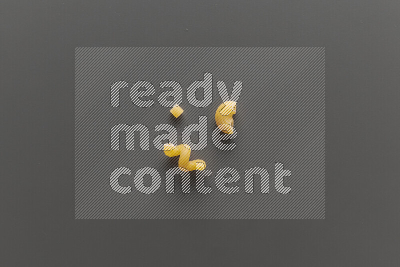 Different pasta types on grey background