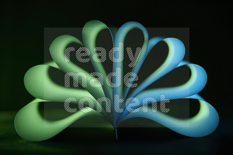 An abstract art piece displaying smooth curves in blue and green gradients created by colored light