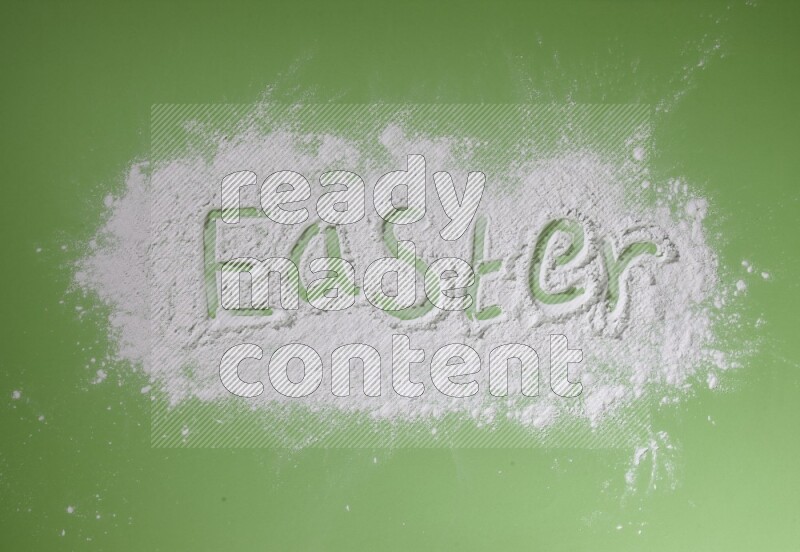 A word written with white powder on green background