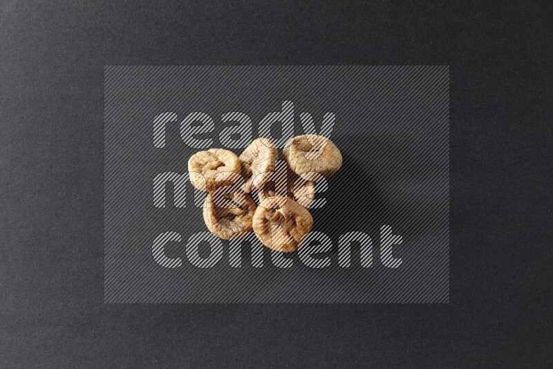 Dried figs on a black background in different angles
