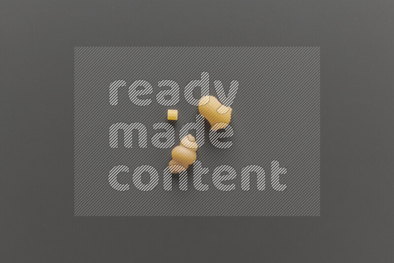 Different pasta types on grey background