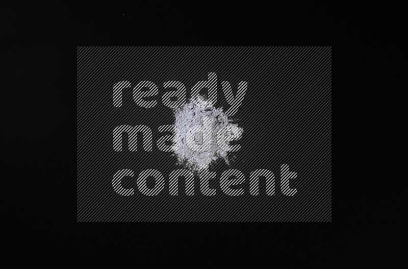 Blue powder on black background