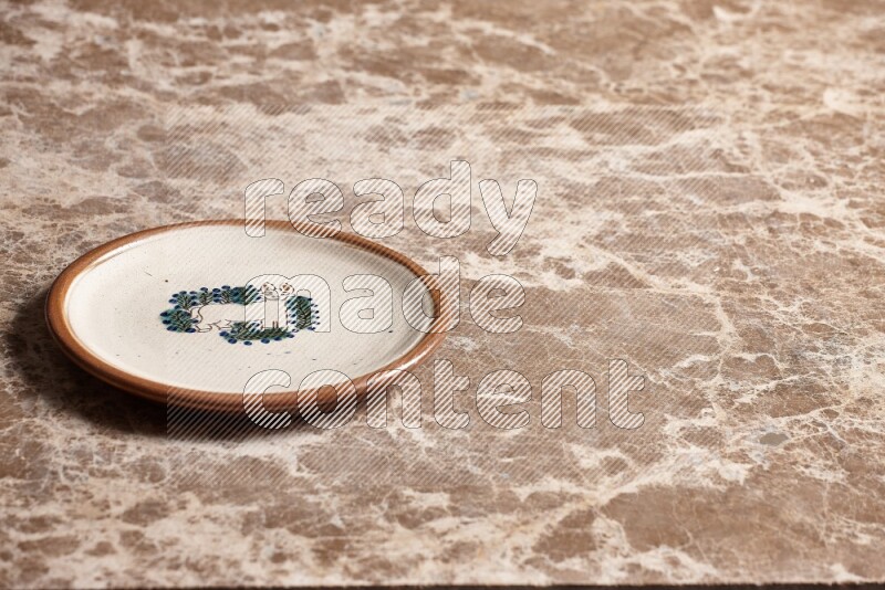 Decorative Pottery Plate on Beige Marble Flooring