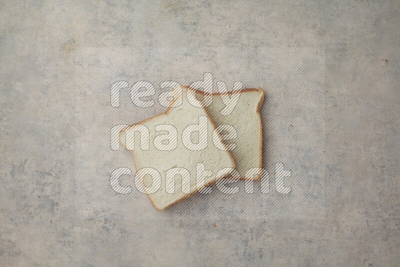 White Toast slices on alight blue textured background