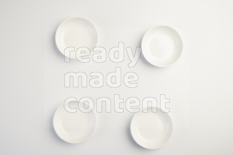 white ceramic round sauce dish on white countertop