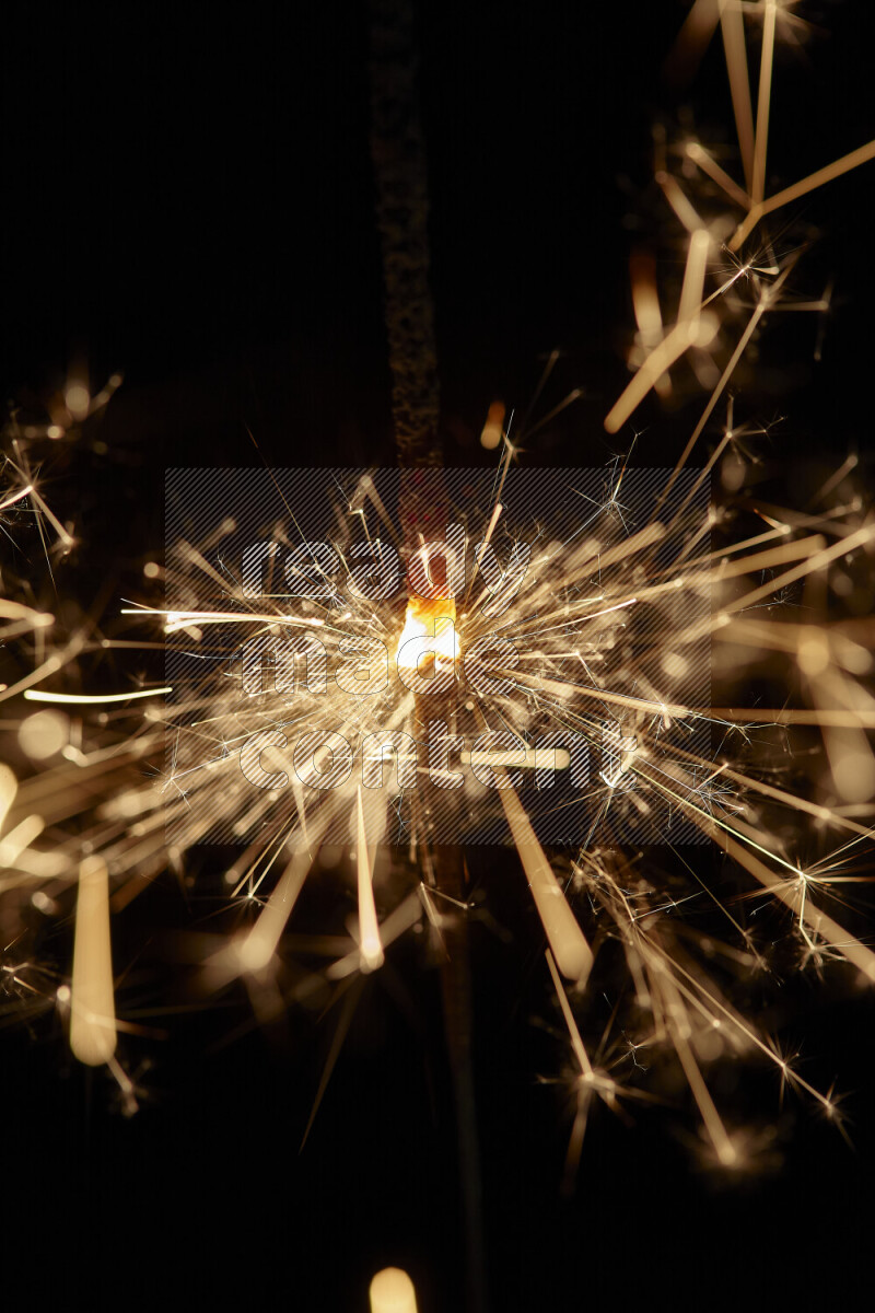 A close-up image of sparkler candle isolated on black background