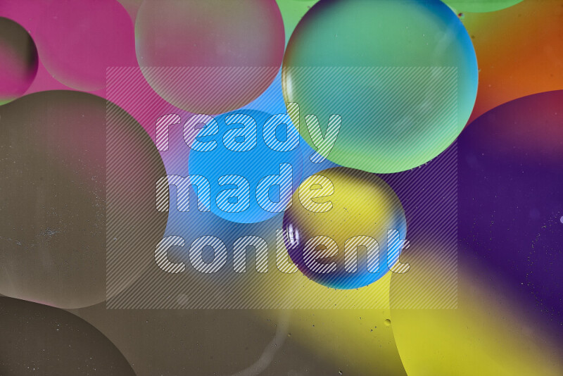 Close-ups of abstract oil bubbles on water surface in multicolors