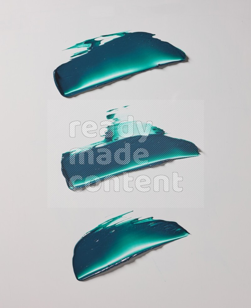 Turquoise painting knife strokes on white background