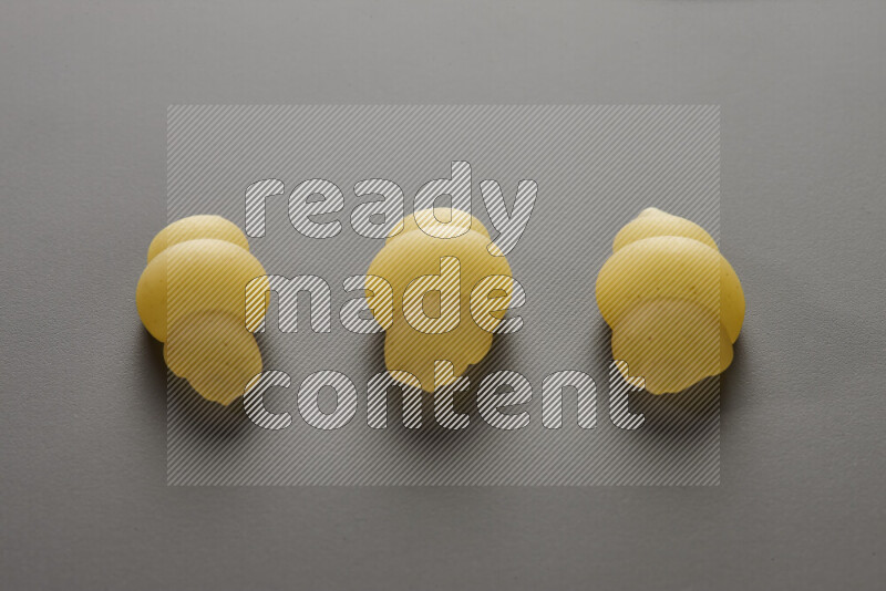 Snails pasta on grey background