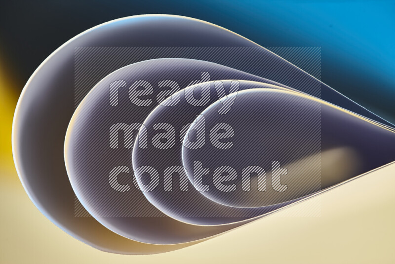 An abstract art of paper folded into smooth curves in blue and yellow gradients