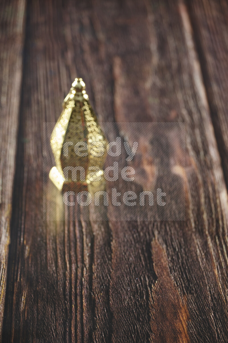 A lantern placed on a wooden background