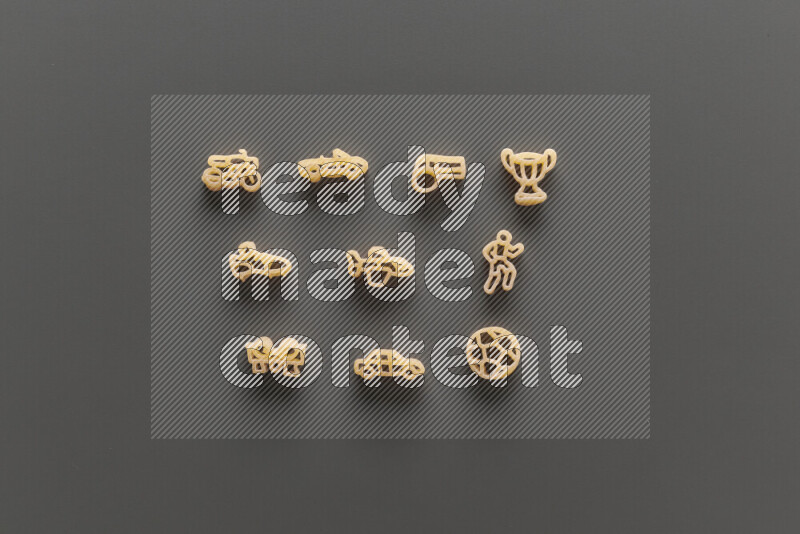 Shaped children pasta on grey background