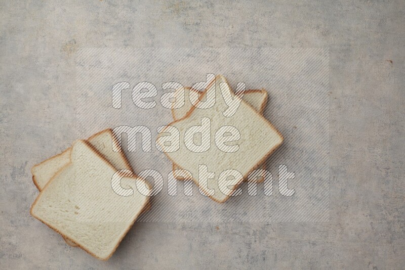White Toast slices on alight blue textured background