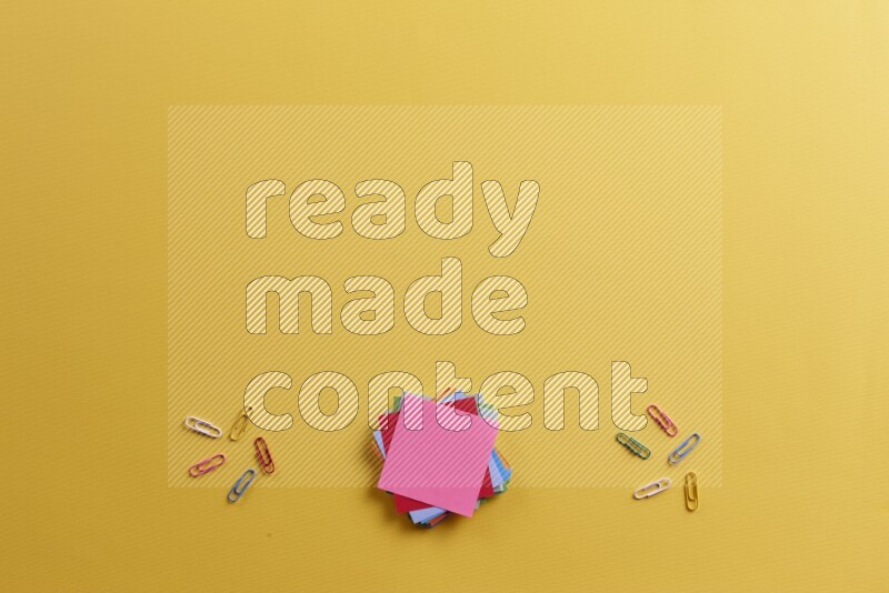 Multicolored sticky notes with school supplies on yellow background