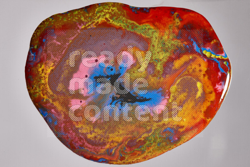 Close-ups of assorted colors blending on a grey background