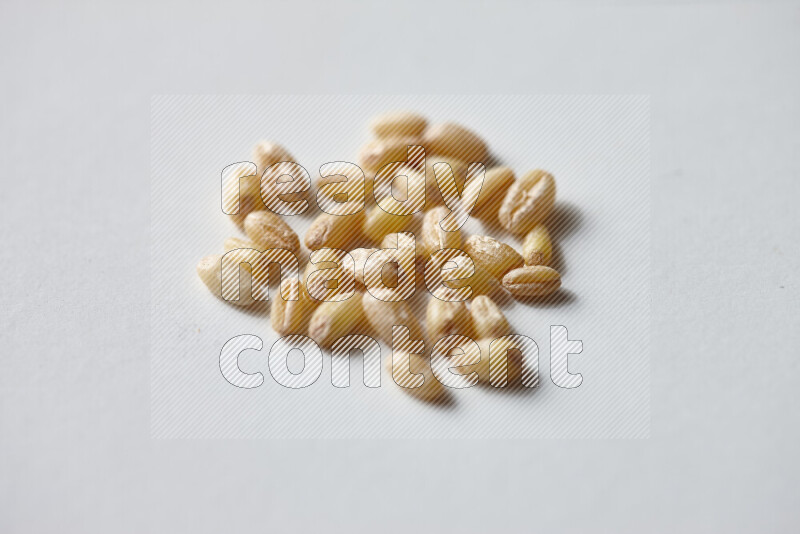 Hulled wheat on white background