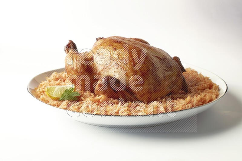 red basmati Rice with whole roasted chicken on a white plate with a silver rim direct on white background
