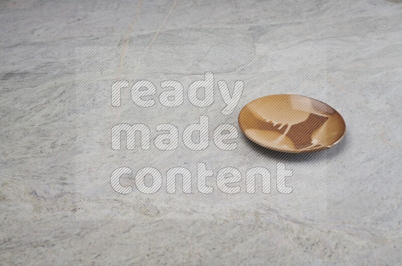 Multicolored Pottery Plate On Grey Marble Flooring