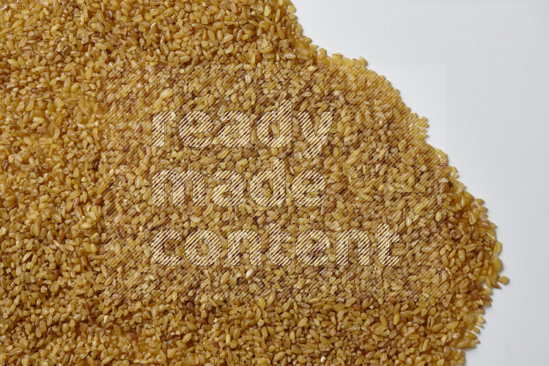 Coarse bulgur on white background