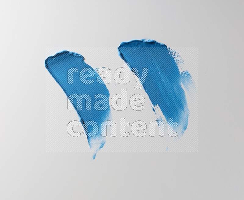Blue painting knife strokes on white background