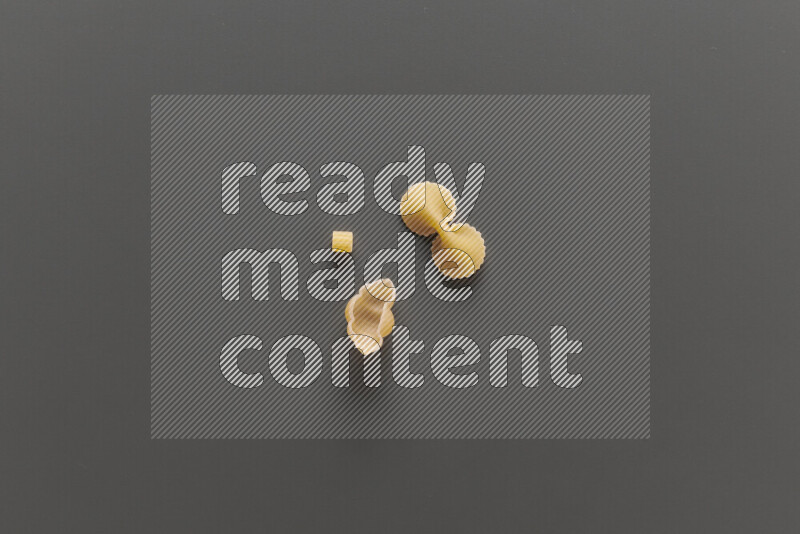 Different pasta types on grey background