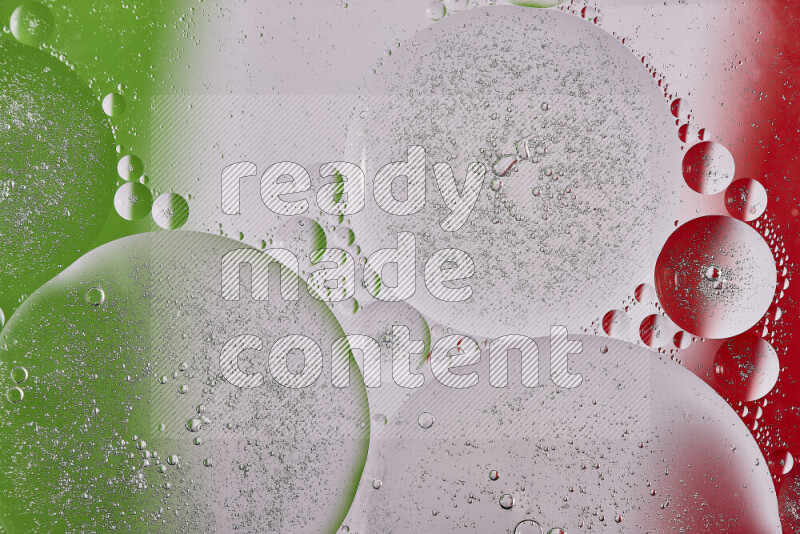Close-ups of abstract oil bubbles on water surface in shades of red, green and white