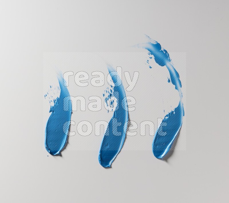 Blue painting knife strokes on white background