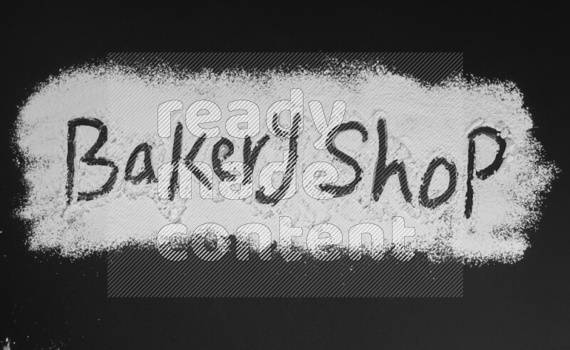 A sentence written with powder on black background