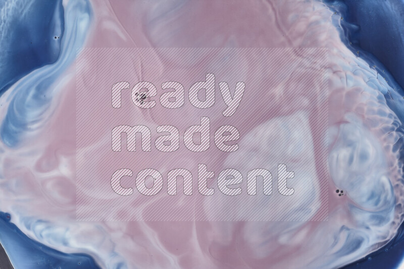 A close-up of abstract swirling patterns in blue, red and white