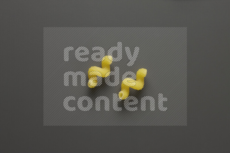 Twist pasta on grey background