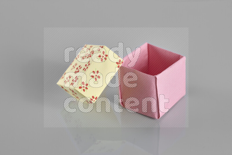 Origami gift box on grey background