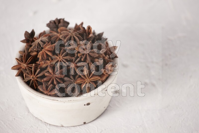 Star Anise in a white bowl on white background