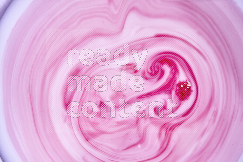 A close-up of abstract swirling patterns in red and white