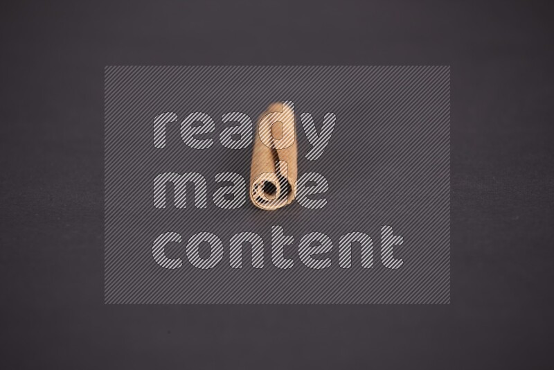 Cinnamon stick on black background