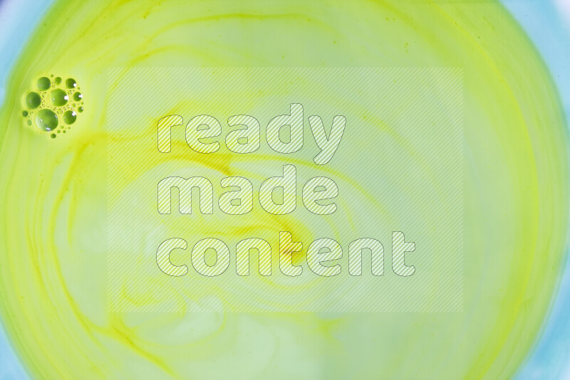 A close-up of abstract swirling patterns in green gradients