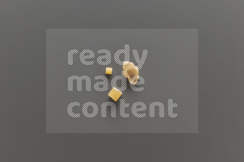Different pasta types on grey background