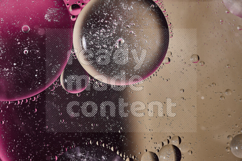 Close-ups of abstract oil bubbles on water surface in shades of pink and brown