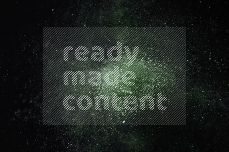 Green powder explosion on black background