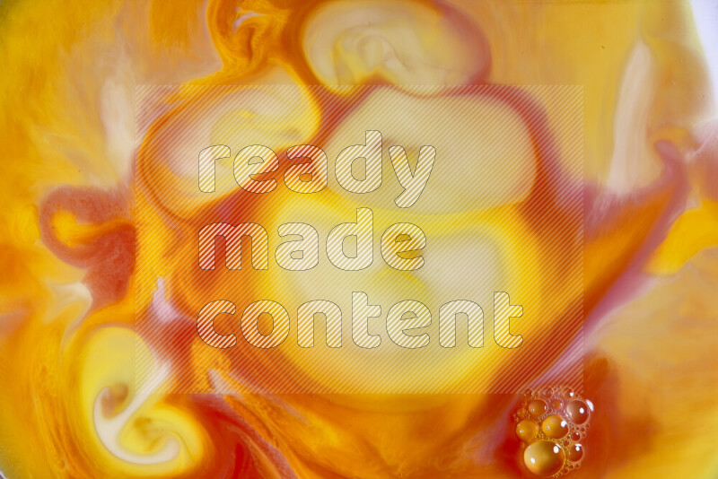 A close-up of abstract swirling patterns in orange, red and white